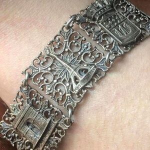 antique silver-plated brass bracelet depicting several Parisian landmarks.